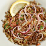 Flavorful Lebanese Lentil & Rice Bowl Topped with Crispy Onions
